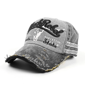 Close-up of Black Rebel embroidery and distressed brim on washed grey baseball cap