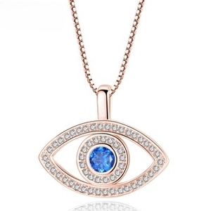 Close-up of rose gold Evil Eye pendant with blue stone and white zircon pave setting