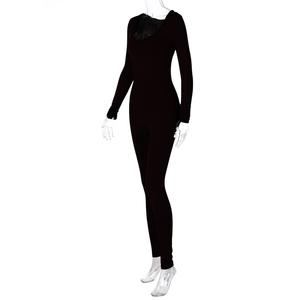 Detail view of the sleek U-neck and slim-fit sleeve on this black bodysuit jumpsuit