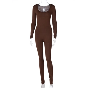 Detailed view of chocolate brown ribbed jumpsuit showing stretch fabric and long sleeve fit