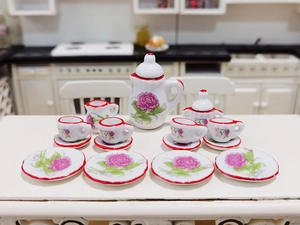 Detailed view of 15-piece miniature ceramic tea set with pink roses for dollhouses