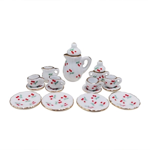 15-piece dollhouse ceramic tea set with red cherry patterns and gold trim on white base