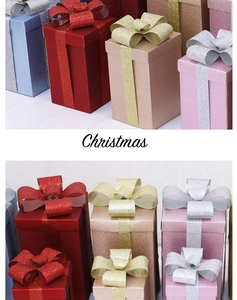 Glittery Christmas gift boxes in multiple colors with silk bows for festive store displays