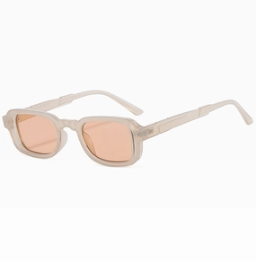 Detail view of vintage square sunglasses with translucent grey frames and orange lenses