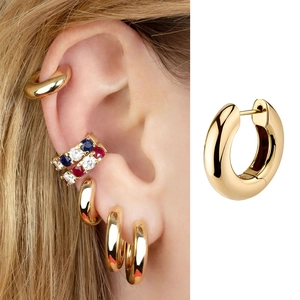 Luxurious gold round hoop earring set with geometric design shown on ear and in detail