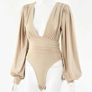 Detail view of khaki deep V-neck bodysuit with long lantern sleeves and cinched waistline