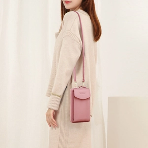Crossbody vertical mobile phone bag for women in soft pink with adjustable strap