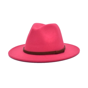 Detailed view of fuchsia wool fedora hat with brown woven leather decorative band