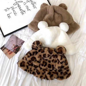 Detailed plush texture of winter faux fur bucket hats with cute bear ears and leopard print