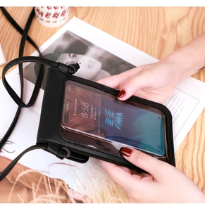 Detail of black PU leather crossbody bag featuring a transparent touch screen phone window