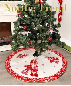 Close-up of 122cm Christmas tree skirt with reindeer pattern and snowflake border decor