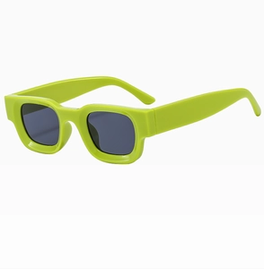 Detailed side view of neon green rectangular sunglasses with dark grey lenses for women