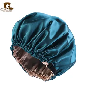 Double-layer satin sleep cap in dark green and pink with adjustable buckle