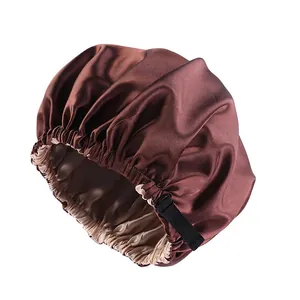 Double-layered satin sleep bonnet in dark brown with beige lining and adjustable strap