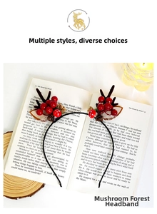 Close-up of Christmas reindeer antler headband with red berries and mushrooms on a book