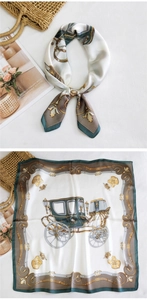 Detail of vintage carriage print silk square scarf with green and gold ornate border