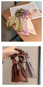 Detail of satin bow scrunchies with long ribbons in multiple pastel colors