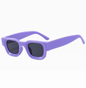 Detail of trendy purple thick square frames and glossy finish on these fashion sunglasses