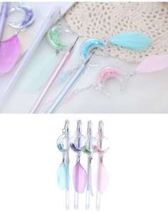 Close-up of creative moon and feather pendant gel pens with colorful sequins and ink tips