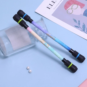 Blue and green spinning pens with starry universe patterns and weighted ends for balance