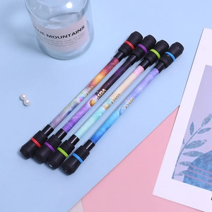 Detail of star galaxy spinning pens with weighted balance caps for beginners