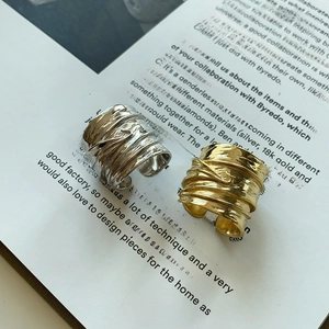Macro shot of 925 sterling silver wide leaf rings with unique wrinkled texture