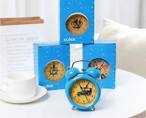 Blue metal vintage style alarm clock with classic car dial and branded clock box