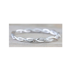 Elegant twisted rope ring in silver finish with pavé cubic zirconia on wooden background