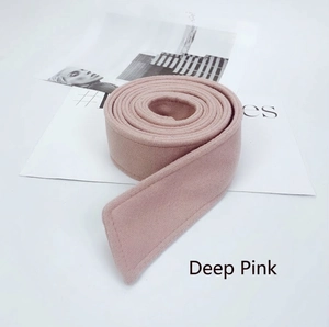 Detail view of deep pink wool coat belt featuring high-quality topstitching and texture