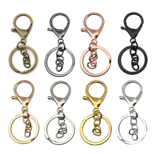 Set of 8 colorful metal keychain rings with lobster clasps and chains on white background