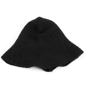 Detail of black knitted bucket hat showing rich texture and thermal wool fabric weave
