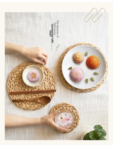 Detail of hand-woven natural seagrass placemat featuring intricate textured fiber patterns