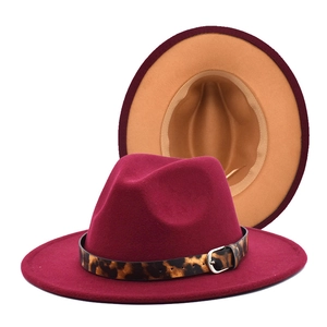Detail of wool fedora with burgundy exterior, camel interior and leopard print band