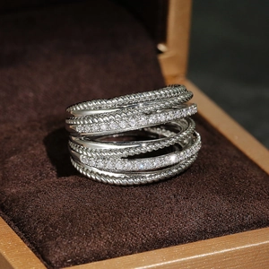 Close-up of a stacked twisted cable ring with micro-pave cubic zirconia on a velvet box
