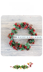 Mini Christmas wreath detail showing red berries and pinecones with an 11cm diameter