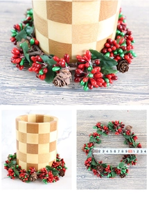 Close-up of artificial red and green berry wreath with natural pinecones and 10cm inner diameter