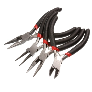 Macro view of 4-piece jewelry pliers set with black non-slip handles for DIY crafts