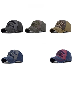 Close-up of vintage washed cotton baseball caps in multiple colors with NYS 84 embroidery