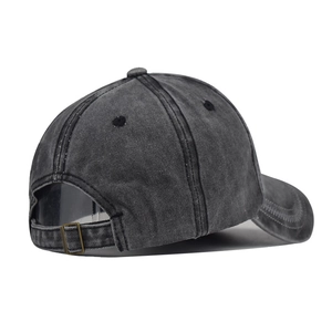 Close-up of black washed cotton baseball cap with adjustable metal buckle strap