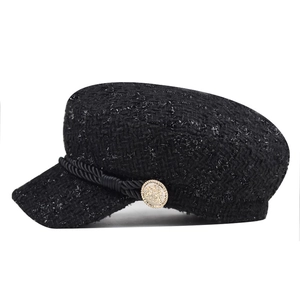 Stylish women's black tweed baker boy hat with decorative rope and gold button.