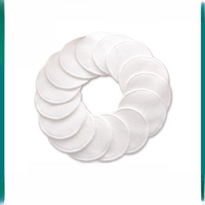 Set of round white bamboo fiber makeup pads arranged in a circle for facial cleansing