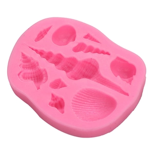 Pink silicone mold featuring various seashell shapes for baking and cake decorating