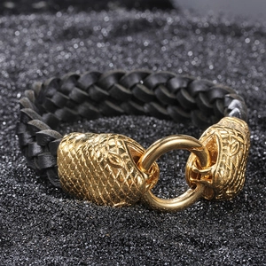 Men's braided black leather bracelet featuring golden twin snake heads and steel ring clasp