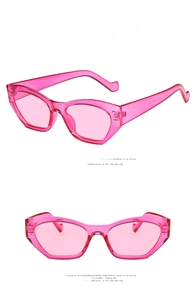 Detail view of transparent roseo cat-eye sunglasses with retro frames and resin lenses
