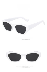 Detailed front and side views of white geometric cat-eye sunglasses with dark grey lenses