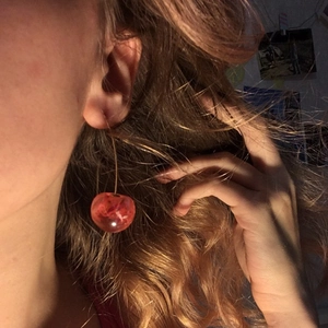 Cute red resin cherry drop earrings on model, sweet summer fruit jewelry for women