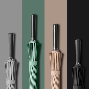 Vertical display of long handle umbrellas in grey, green, beige, and black minimalist tones