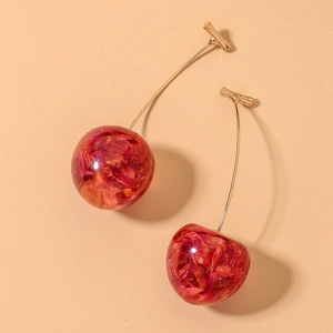 Close-up of sweet cherry earrings featuring golden stems and red dried flower petals