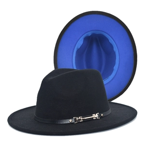 Detail of black wool fedora hat with royal blue contrast lining and gold metal buckle strap