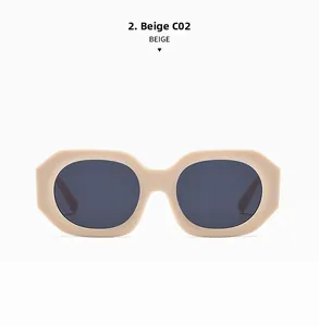 Detail of chunky beige irregular frame sunglasses with dark grey lenses in macro view